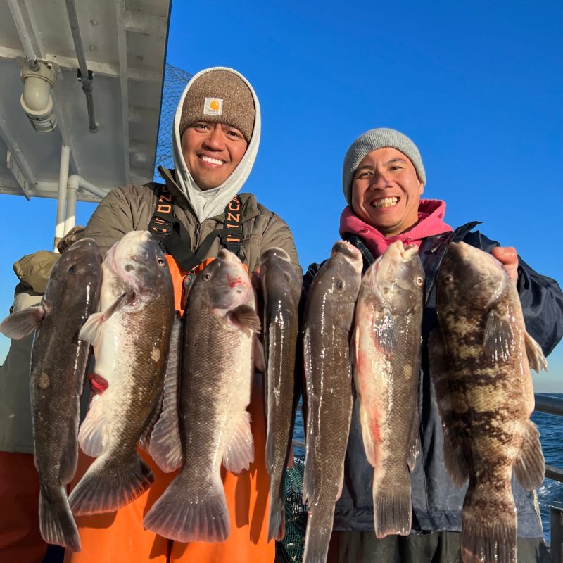 a man holding a fish