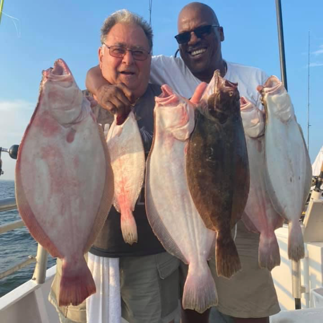 a man holding a fish