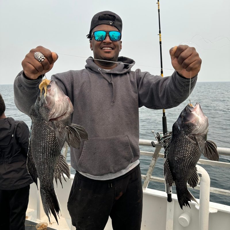 a person holding a fish