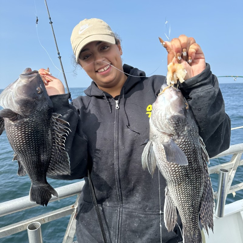 a person holding a fish