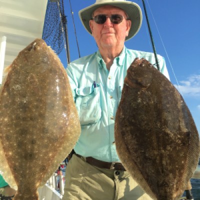 a man holding a fish