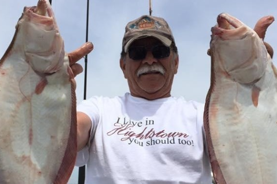 a man holding a fish