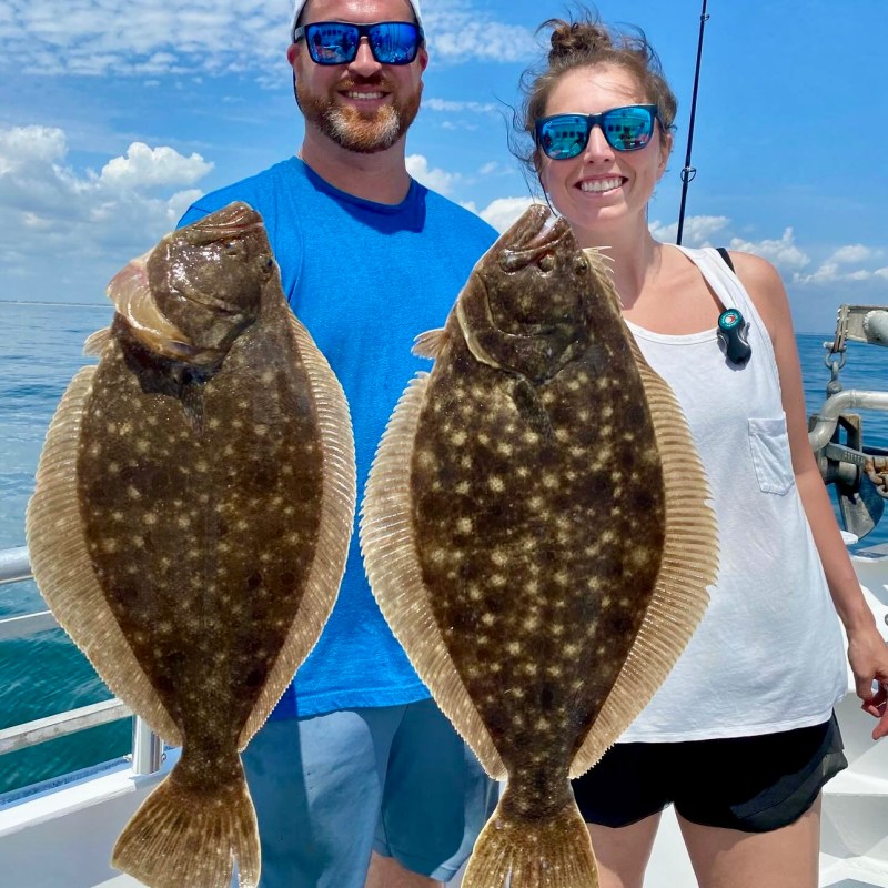a couple of people that are standing in the water