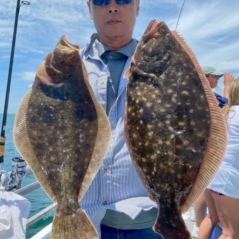 a person holding a fish