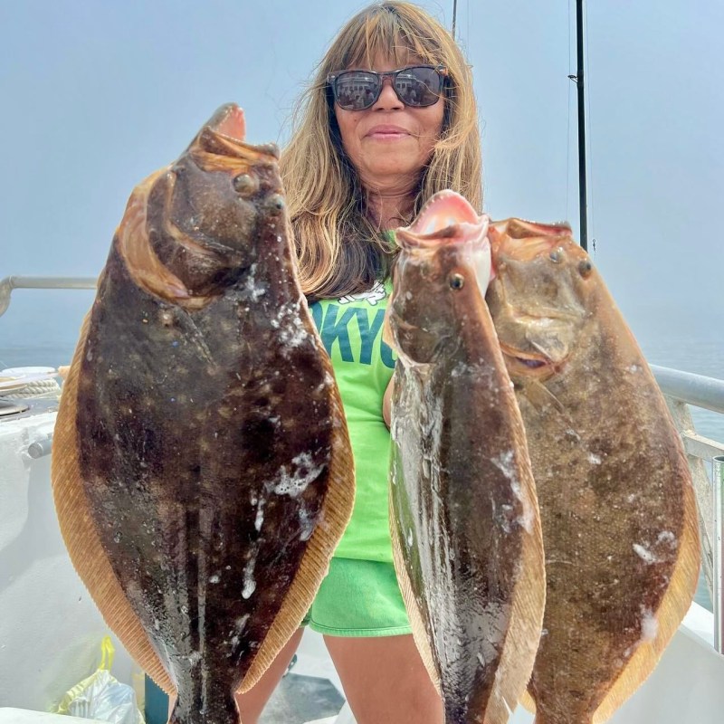 a person holding a fish